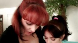 Redhead MILF shows young babe how to finger and lick pussy